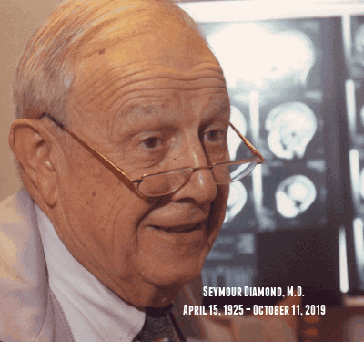 An elderly man with glasses smiles in front of brain scan images; text reads “Seymour Diamond, M.D. April 15, 1925 – October 11, 2019.”.