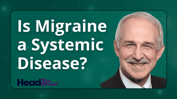 A man in a suit smiles next to text that reads, 