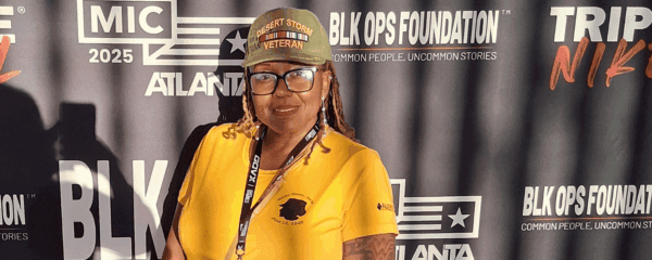 A woman wearing a yellow shirt and a 