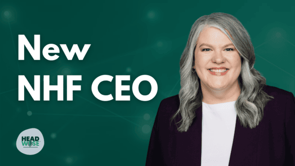Smiling woman in a professional blazer on a green background with the text ‘New NHF CEO’ and the HeadWise logo, representing the National Headache Foundation’s new CEO announcement.