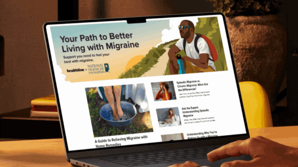 A laptop screen displays a webpage titled 