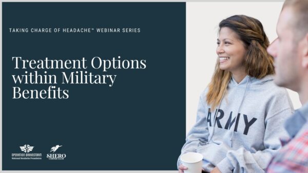 Two people sit together, one wearing an 